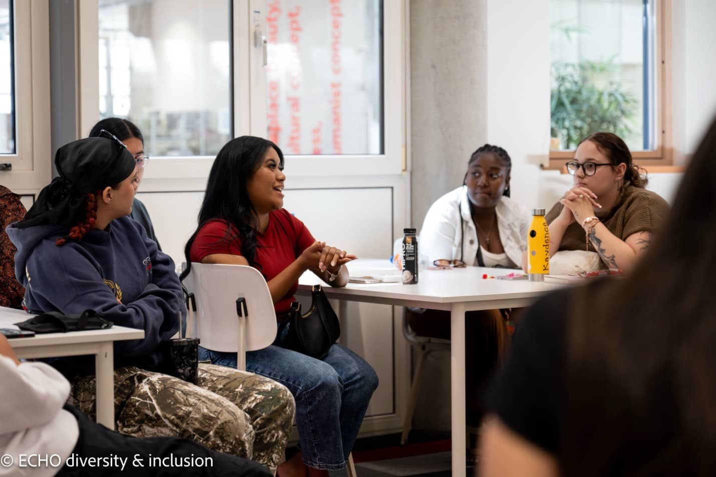 Tyra Delos Reyes, center, participates in a class discussion at The Hague University of Applied Sciences. Photo courtesy of ECHO Expertise Center for Diversity Policy