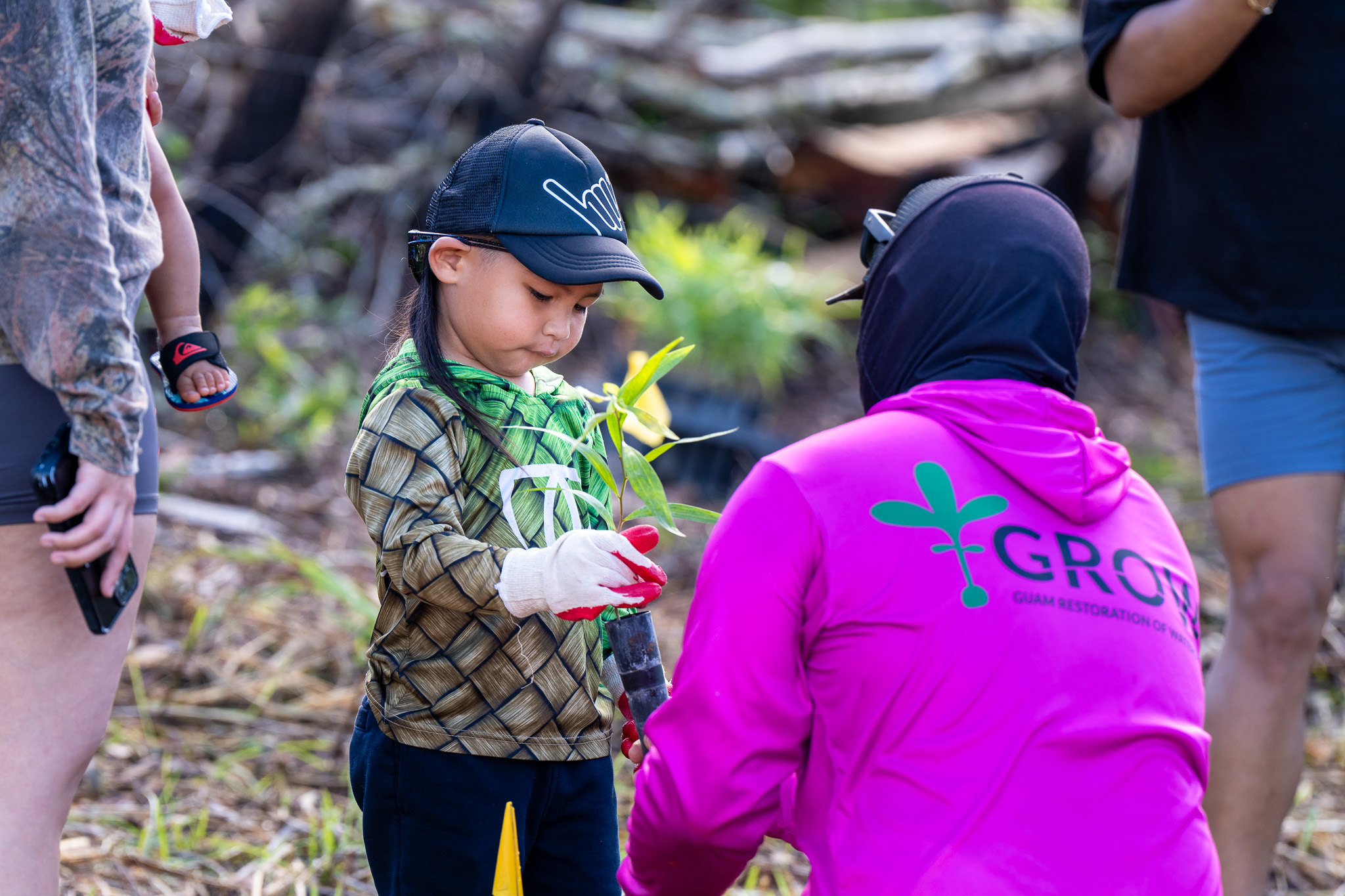 GROW Project Lead assists 4-year-old volunteer